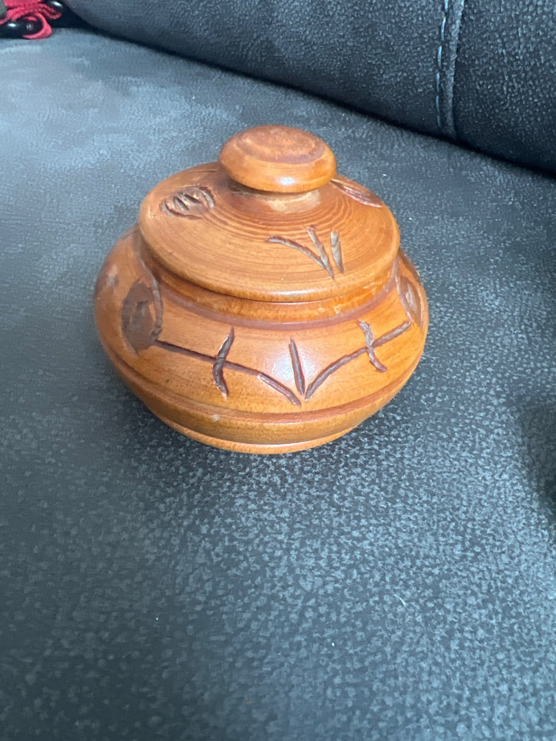 Hand-carved wooden trinket box with a matching lid