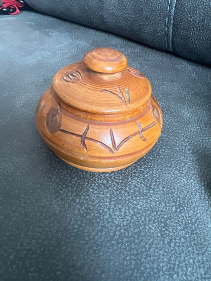 Hand-carved wooden trinket box with a matching lid