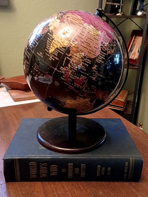 Vintage hard cover book 1964 "who's who", 8" black globe