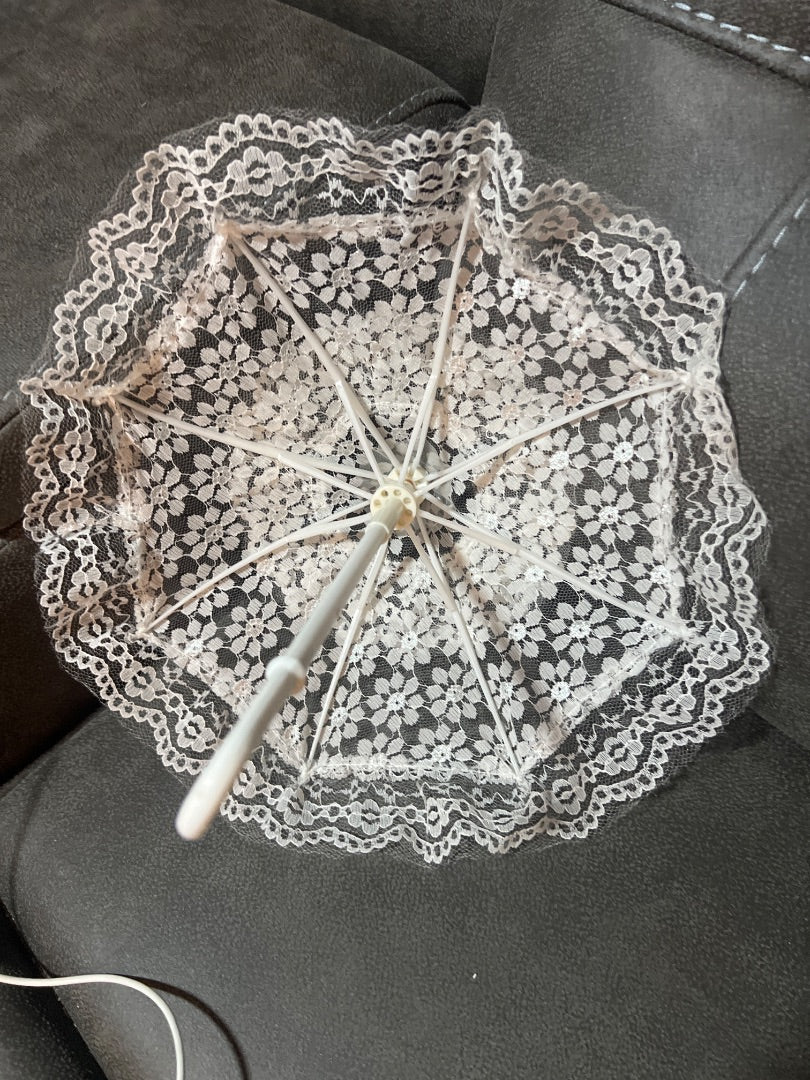 This decorative white lace mini parasol