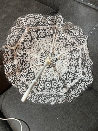 This decorative white lace mini parasol